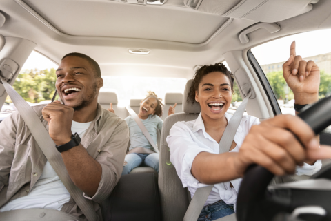 Happy family in a car